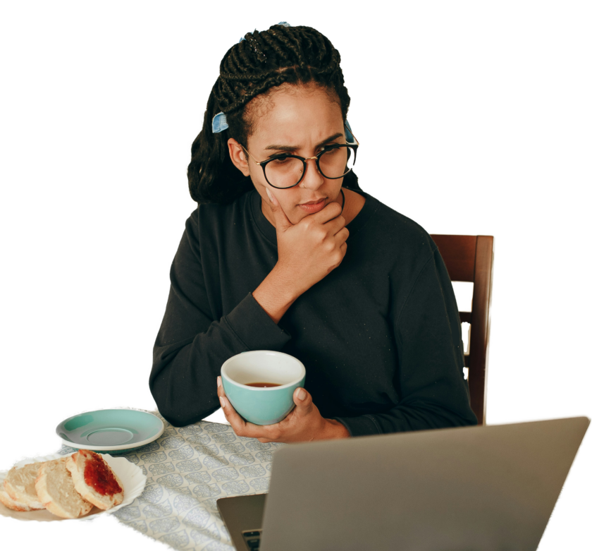 A student sitting at her desk with a laptop.