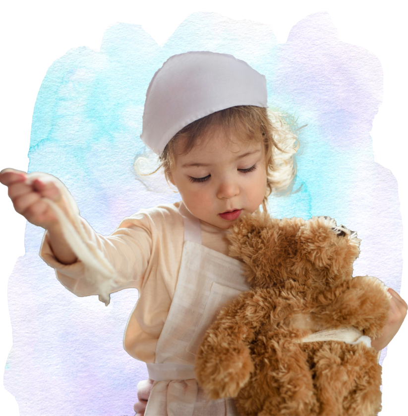 A small child holding a teddy bear.