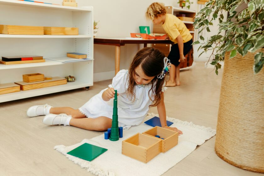 young girl playing with building blocks